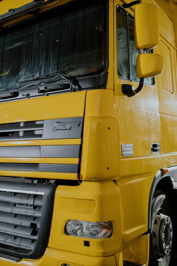 A Yellow DAF XF Truck Close-Up Photo